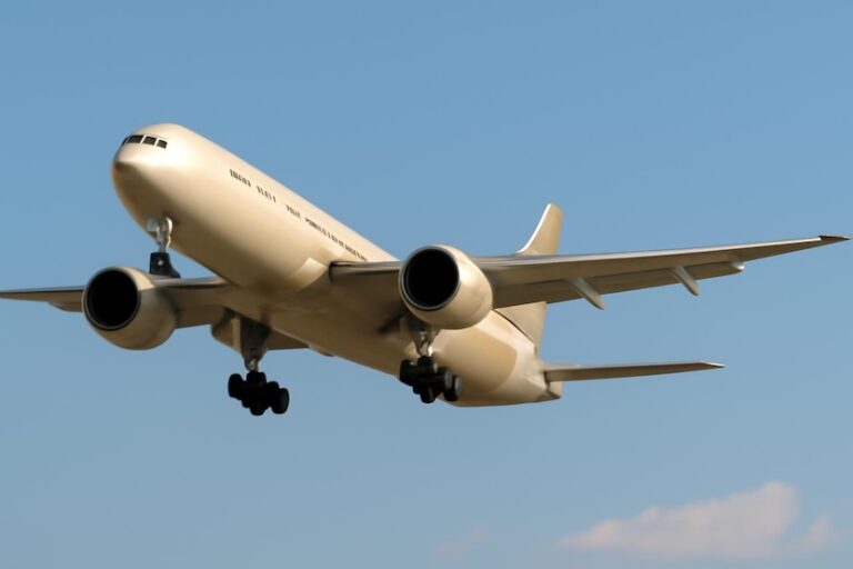 Commercial jet airliner descending for landing with landing gear down against a blue sky