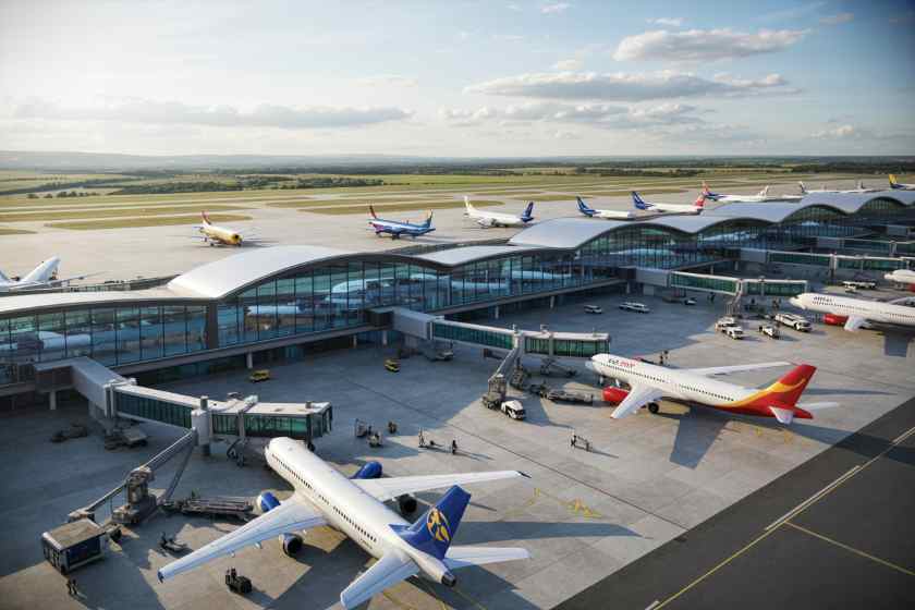 A bustling airport tarmac with a curved glass terminal and several airplanes parked at gates.