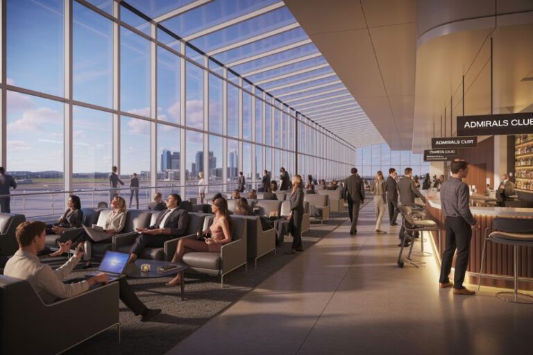 Spacious airport lounge with floor‑to‑ceiling windows, groups of travelers seated on modern armchairs, some using laptops, overlooking an airfield and city skyline outside.