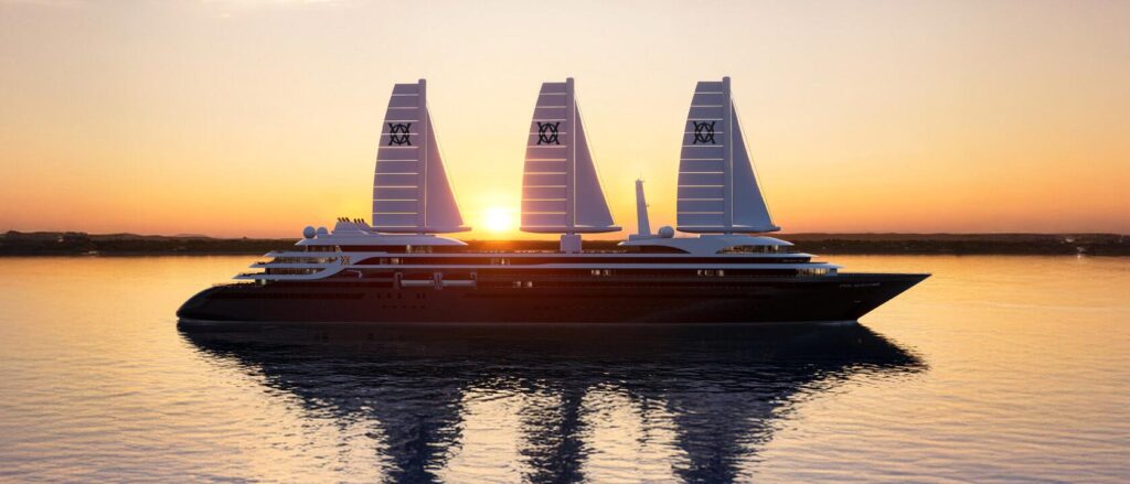 Luxurious three-masted yacht sailing at sunset with calm water and its reflection on the surface