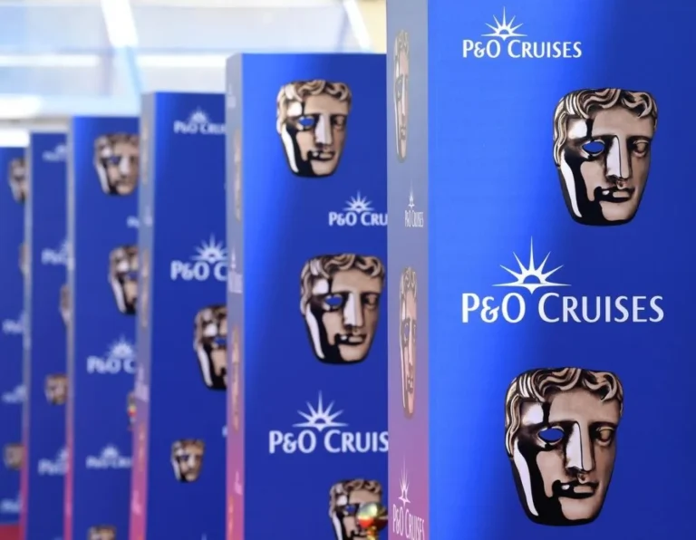 Row of blue P&O Cruises banners featuring a beige theatrical mask logo in a hallway.