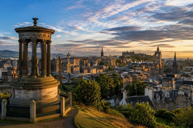 Dugald Stewart Monument on Calton Hill overlooking Edinburgh’s skyline at sunset