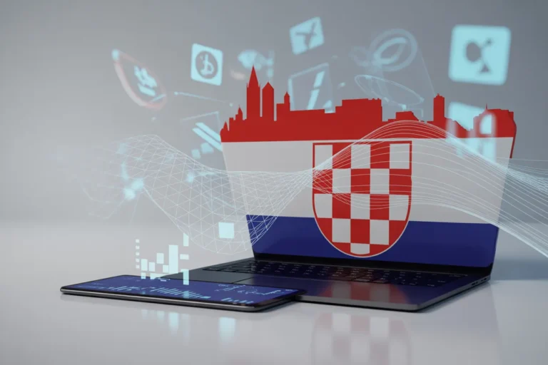 Laptop and smartphone with a Croatian flag overlay, symbolizing Croatia’s tech and digital connectivity.