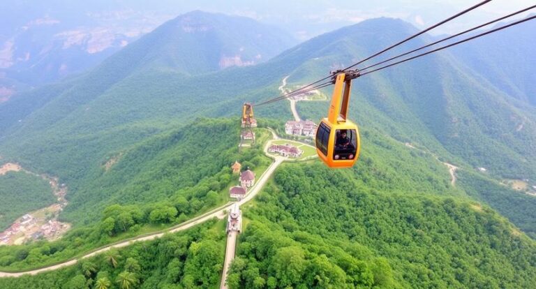 Orange cable car gliding over lush green mountains with a winding road and small village below.