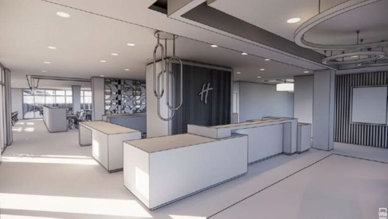 Modern hotel/office reception area with white counters, a dark paneled wall featuring a logo, and geometric decor pieces.