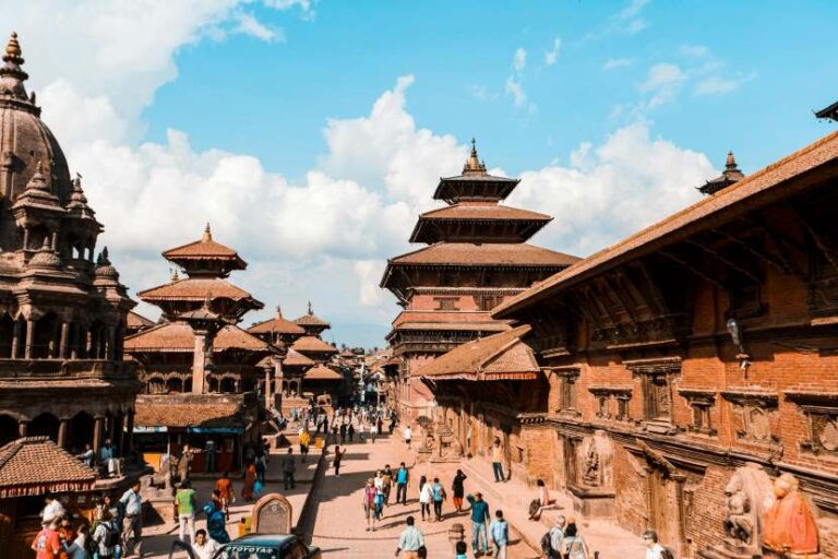 Bustling square with brick temples and pagodas in Kathmandu's Durbar Square.