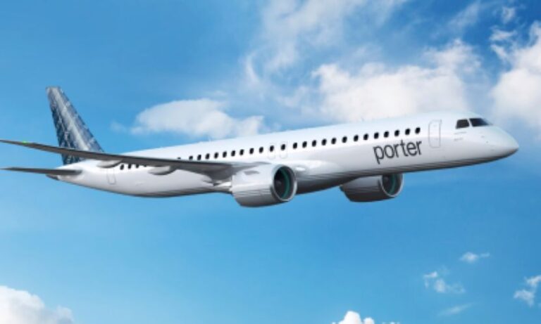 White Porter aircraft in a clear blue sky midflight, engines running smoothly.