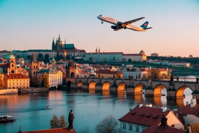 Plane taking off over Prague skyline with the Charles Bridge and Vltava River at sunset; golden-hour city view.