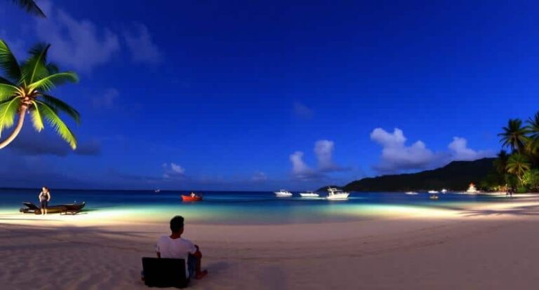 Tropical beach at dusk with palm trees, a man sitting on a bench facing the calm turquoise water, boats anchored offshore.