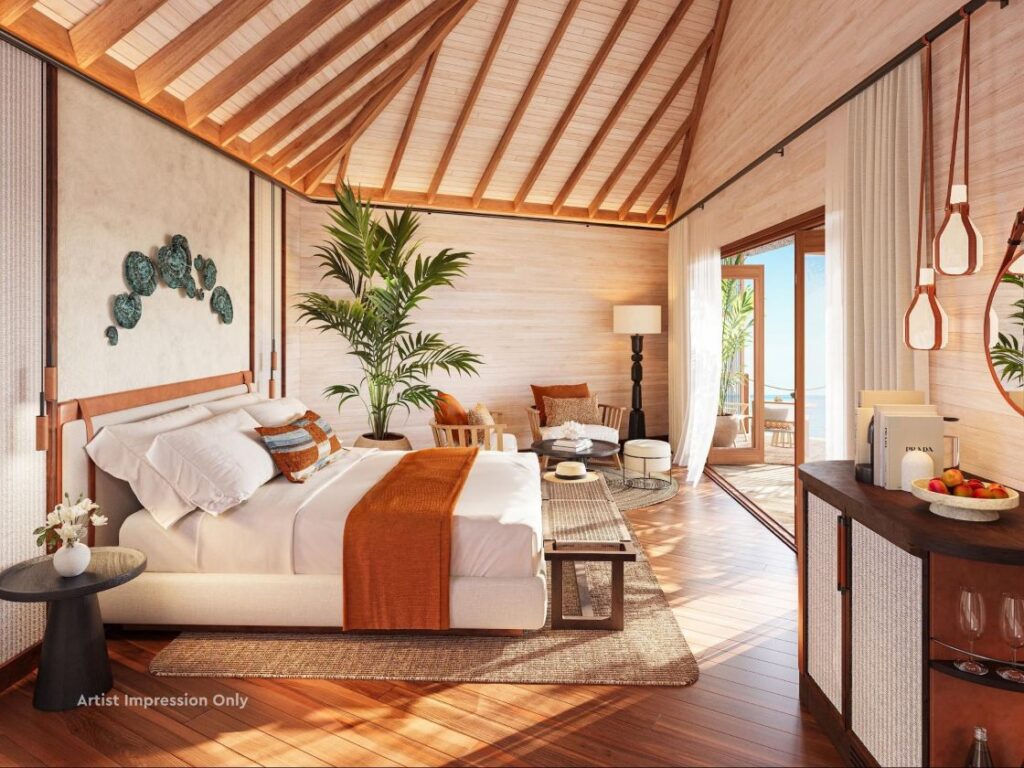 Luxurious bedroom with a king bed, orange throw, and tropical plants in a sunlit suite with a wooden vaulted ceiling and balcony.] that might be too long.