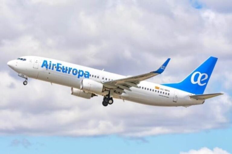 Air Europa passenger jet lifting off with cloudy sky in the background, blue airline branding on the fuselage and tail.”,