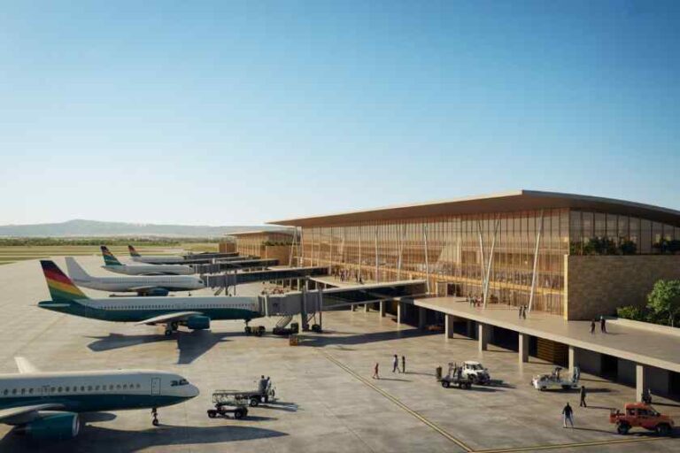 Modern airport terminal with glass façade and jetbridges, several airplanes parked at gates on a sunny tarmac.