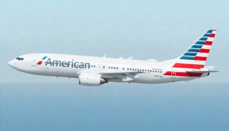 American Airlines passenger jet in flight against a clear blue sky, showing the striped tail design and logo on the fuselage