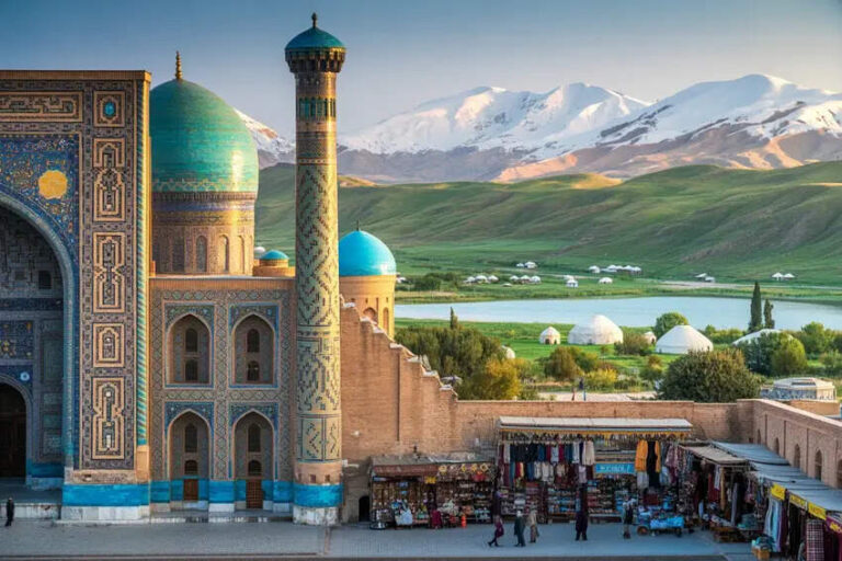 Turquoise-domed mosque complex with a tall minaret and ornate tilework, mountains in the distance and a market in the foreground.