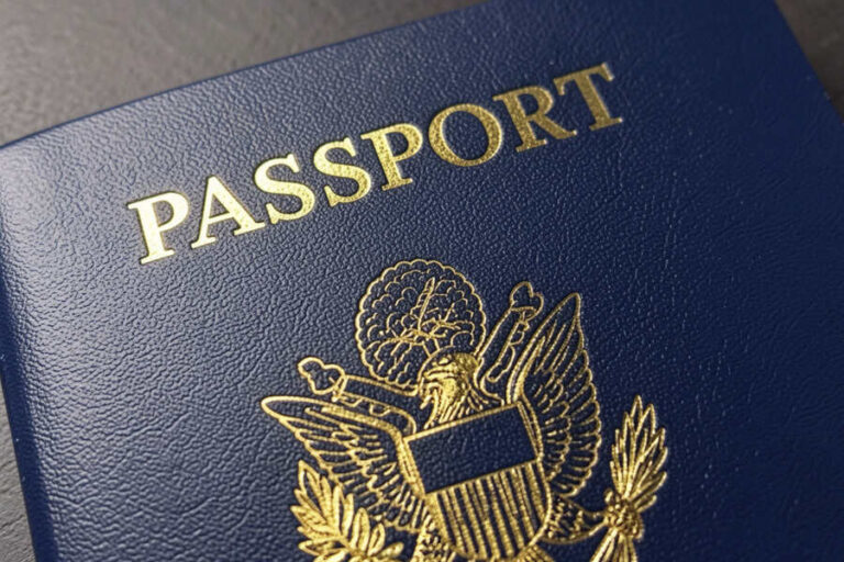 Blue passport cover featuring a gold embossed eagle seal and the word PASSPORT above it.
