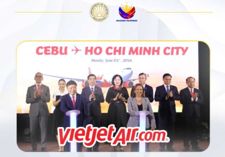 Officials and executives at a launch event for the Cebu–Ho Chi Minh City flight, with a backdrop featuring the route and VietJet Air branding.