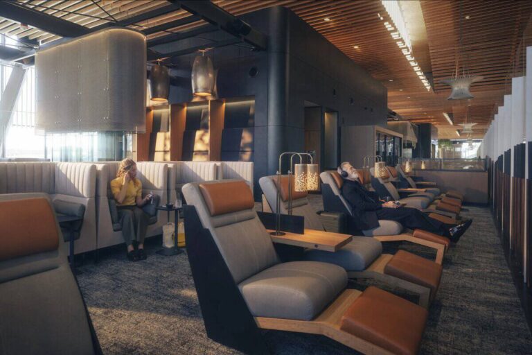 People relaxing in a modern lounge with plush recliners and warm lighting.